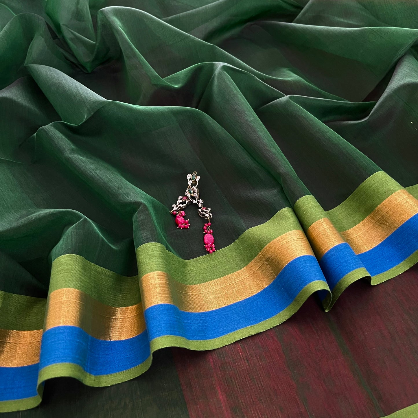 Green and pink Maheshwari saree with zari border