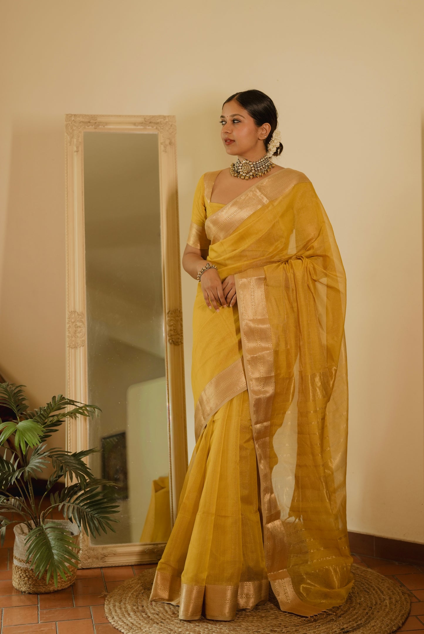 Yellow Maheshwari saree with zari lines all over