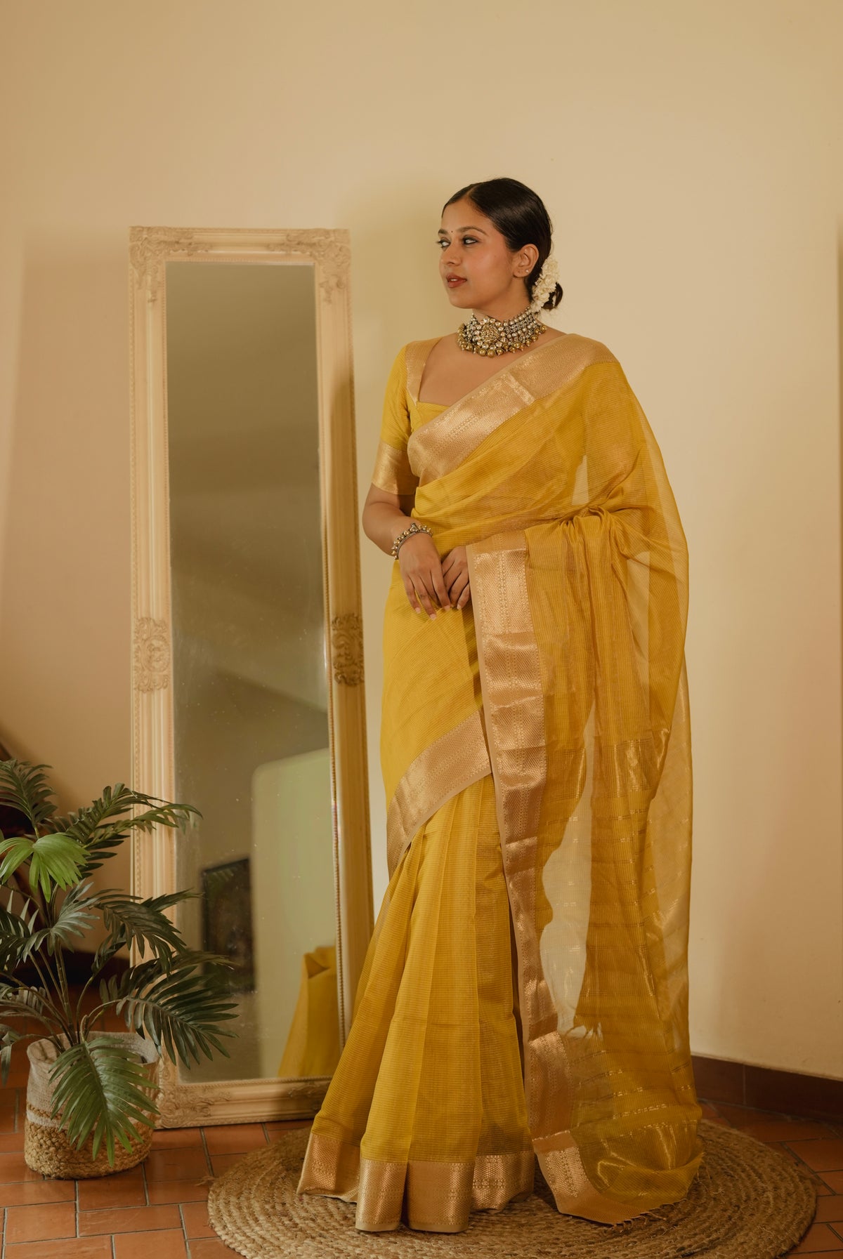 Yellow Maheshwari saree with zari lines all over