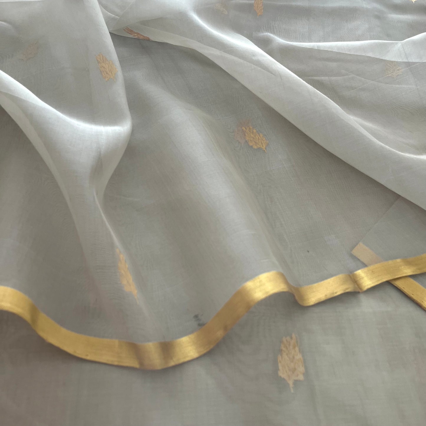 Light grey Chanderi organza silk saree with zari motifs all over