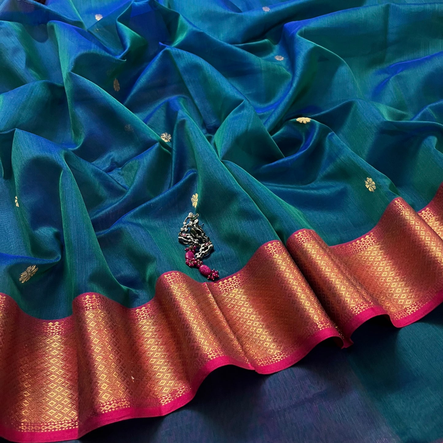 Peacock and Violet dual tone Maheshwari saree with flower motifs on pallu