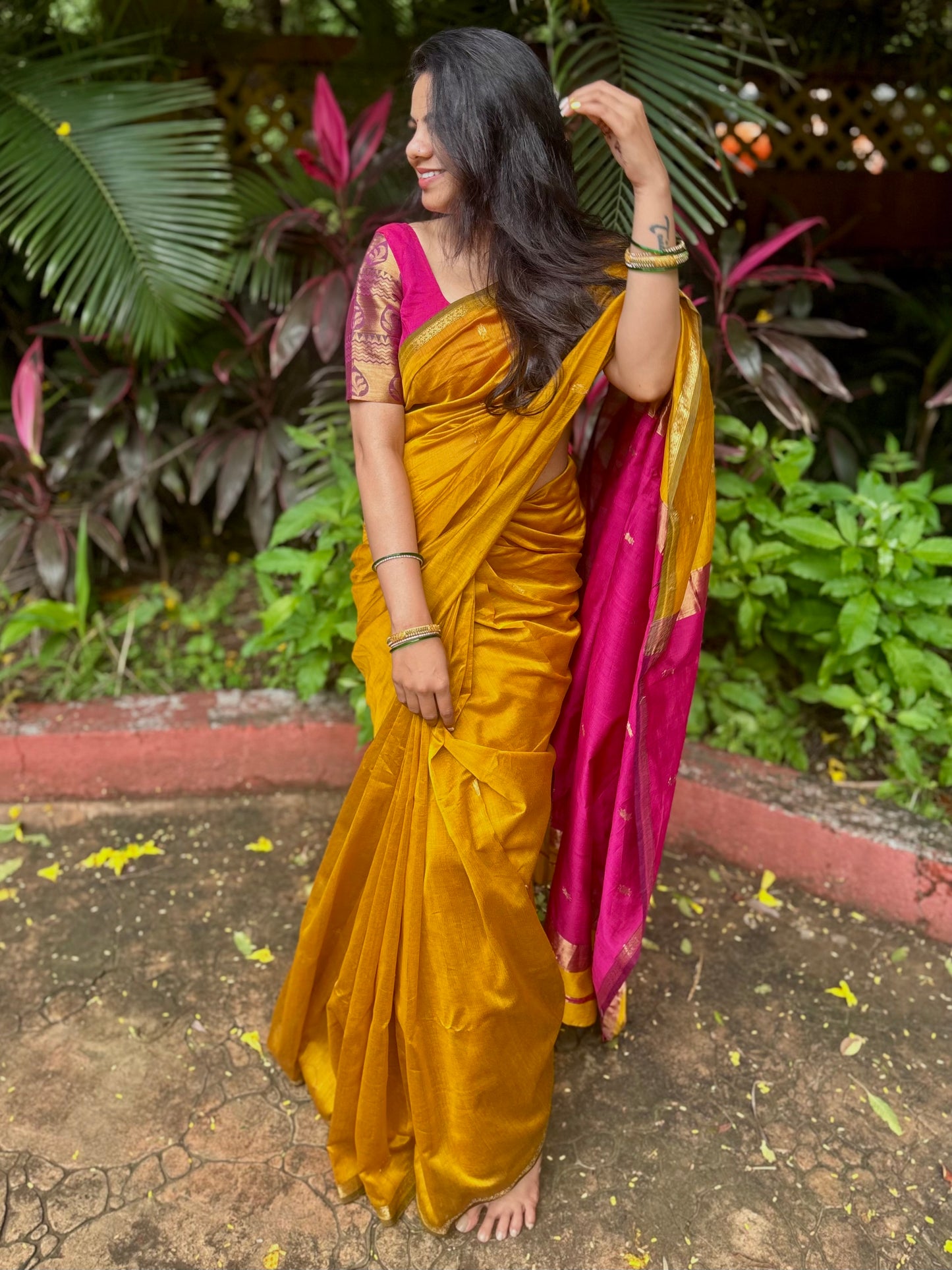 Mustard and pink maheshwari saree with flower bootis all over