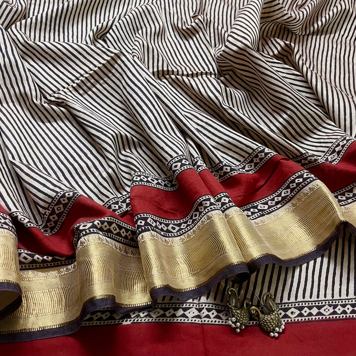 Black and white silk saree with block print all over and zari border