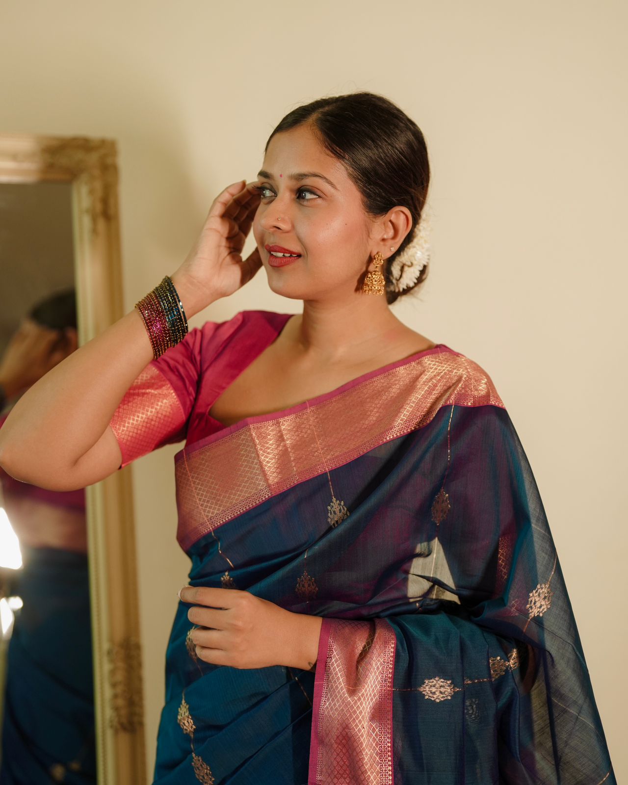 Peacock blue and pink Maheshwari saree with zari motifs all over