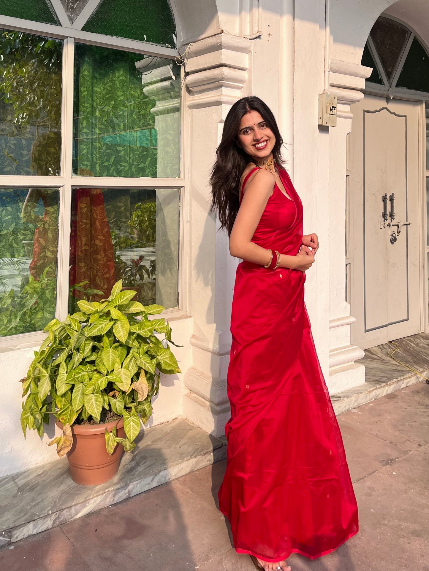Deep red maheshwari saree with zari bootis all over