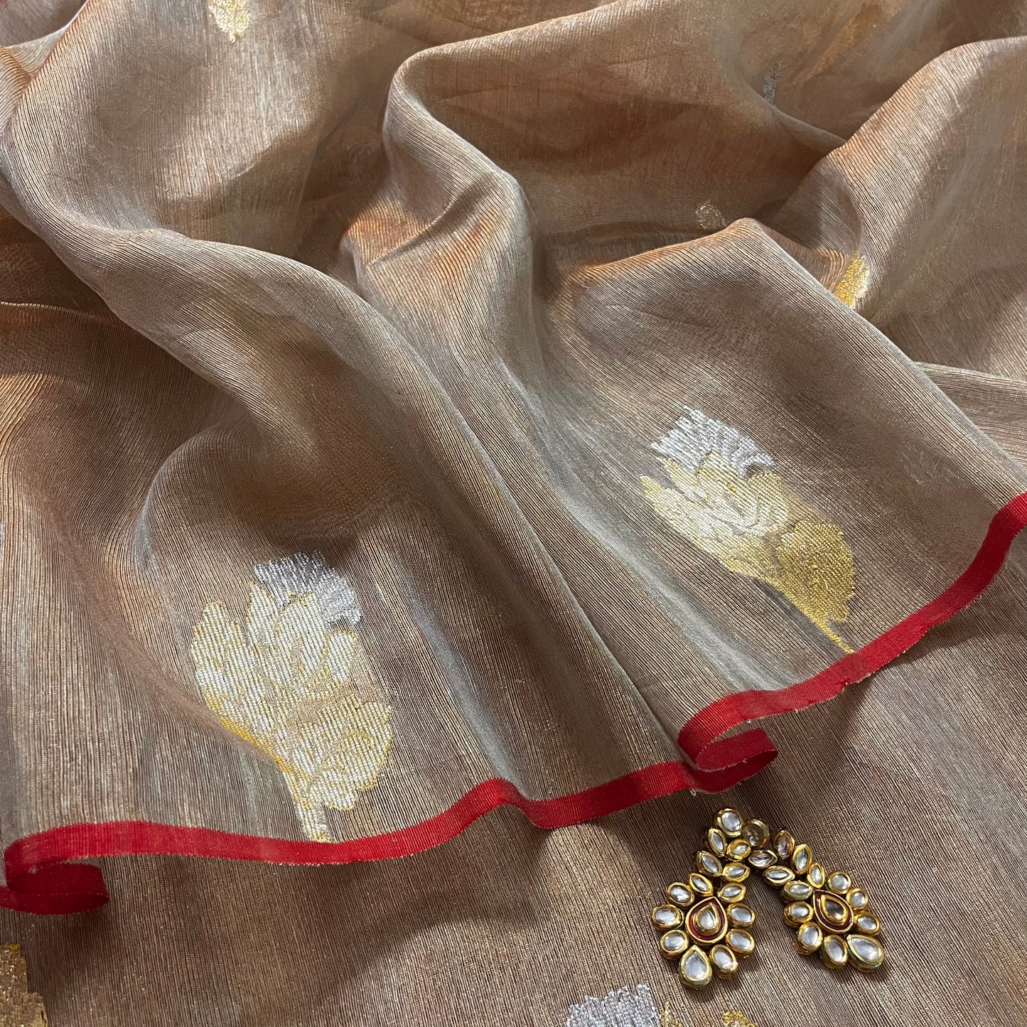 Beige and red linen saree with zari motifs all over