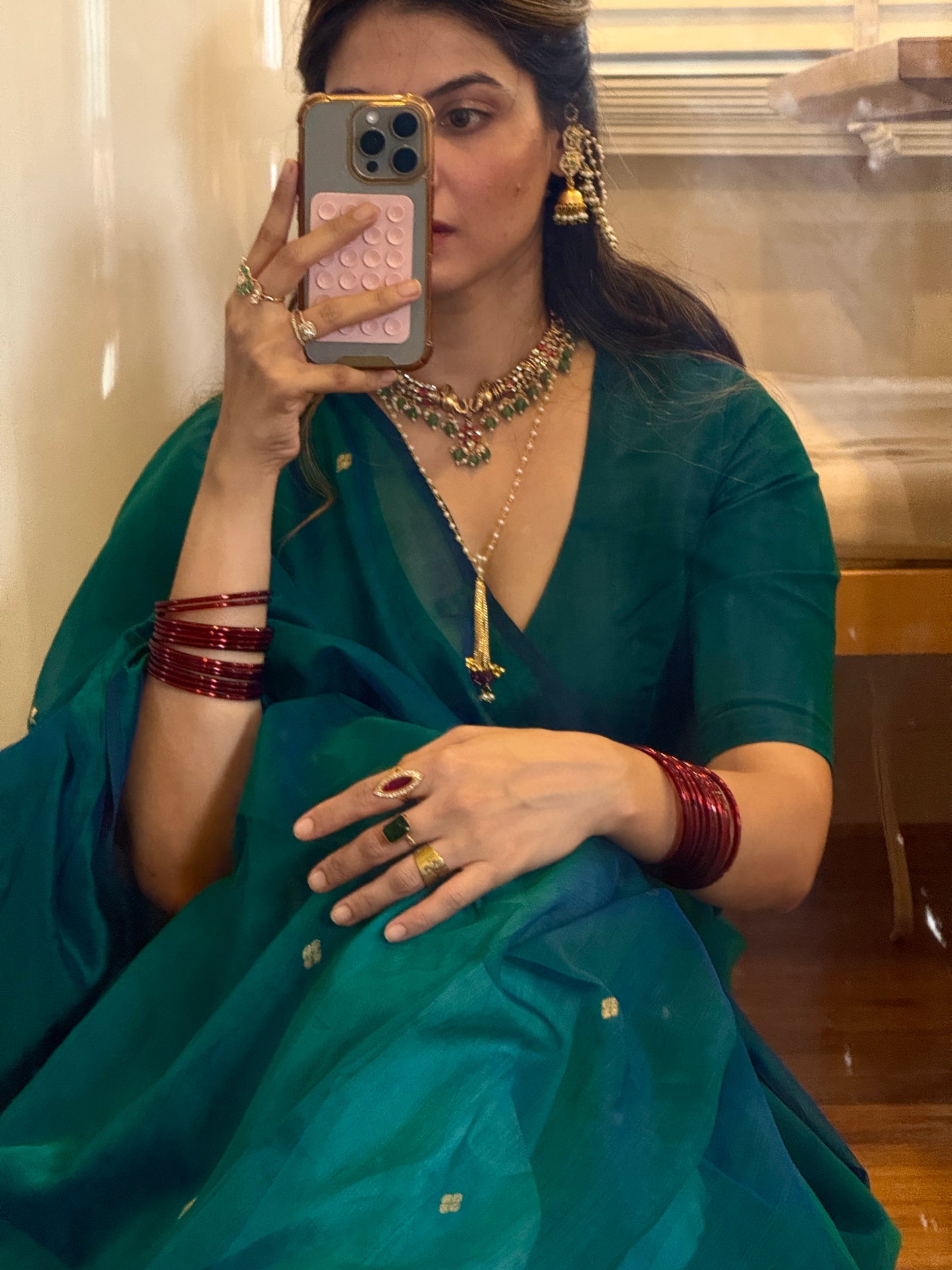 Peacock green and blue dual tone Maheshwari saree with zari bootis all over