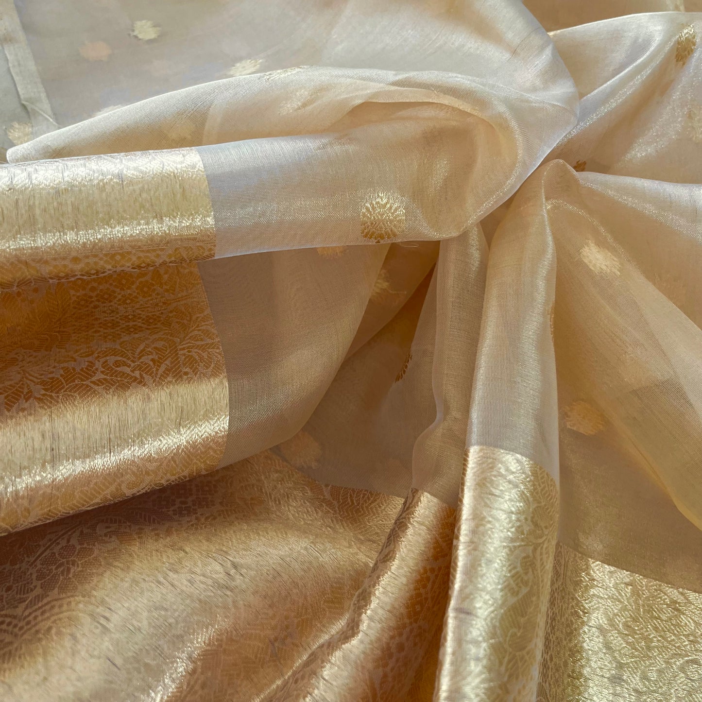 Gold Banarasi tissue silk saree with flower bootis all over