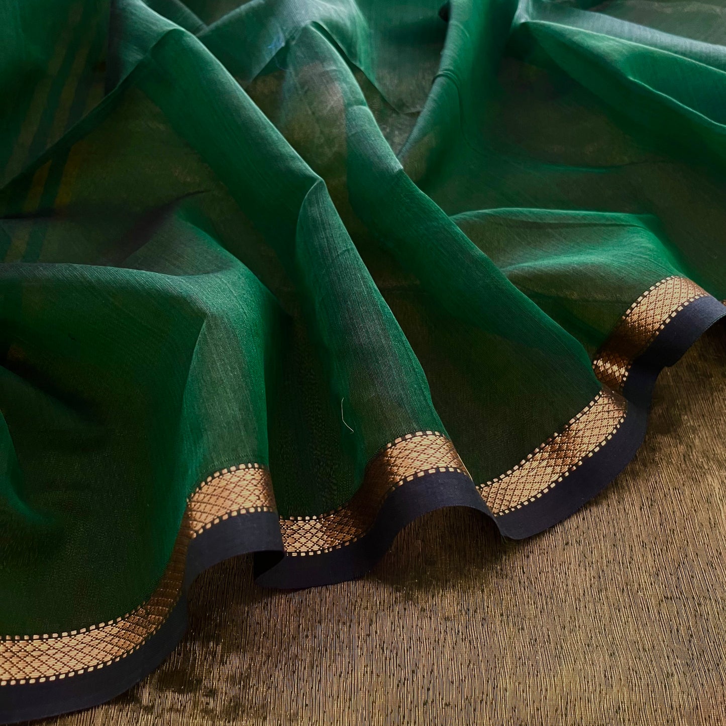 Dark green Maheshwari saree with zari stripes all over