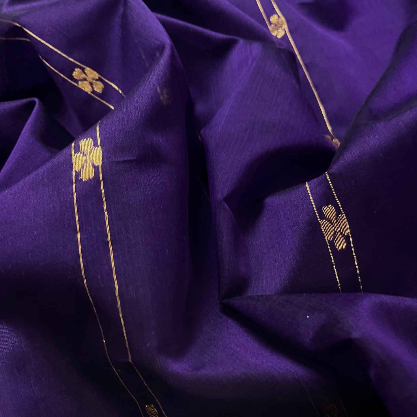 Dark purple Maheshwari saree with dori flower bootis all over