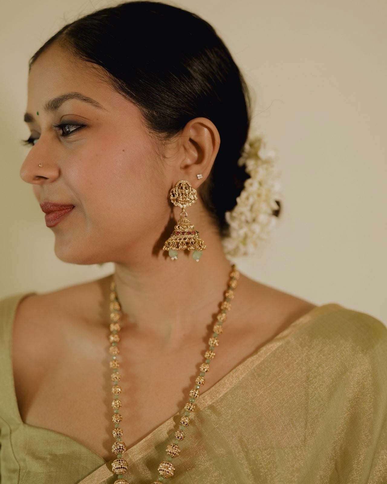Olive gold Maheshwari tissue silk saree with zari bootis all over