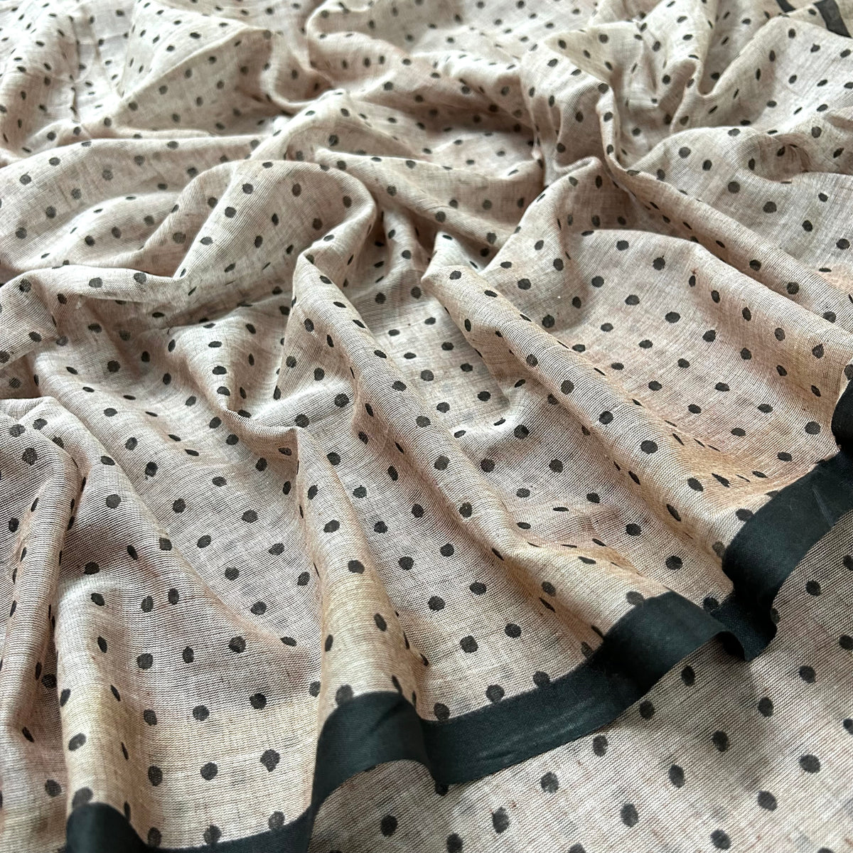Greyish beige and black polka dot mulmul saree