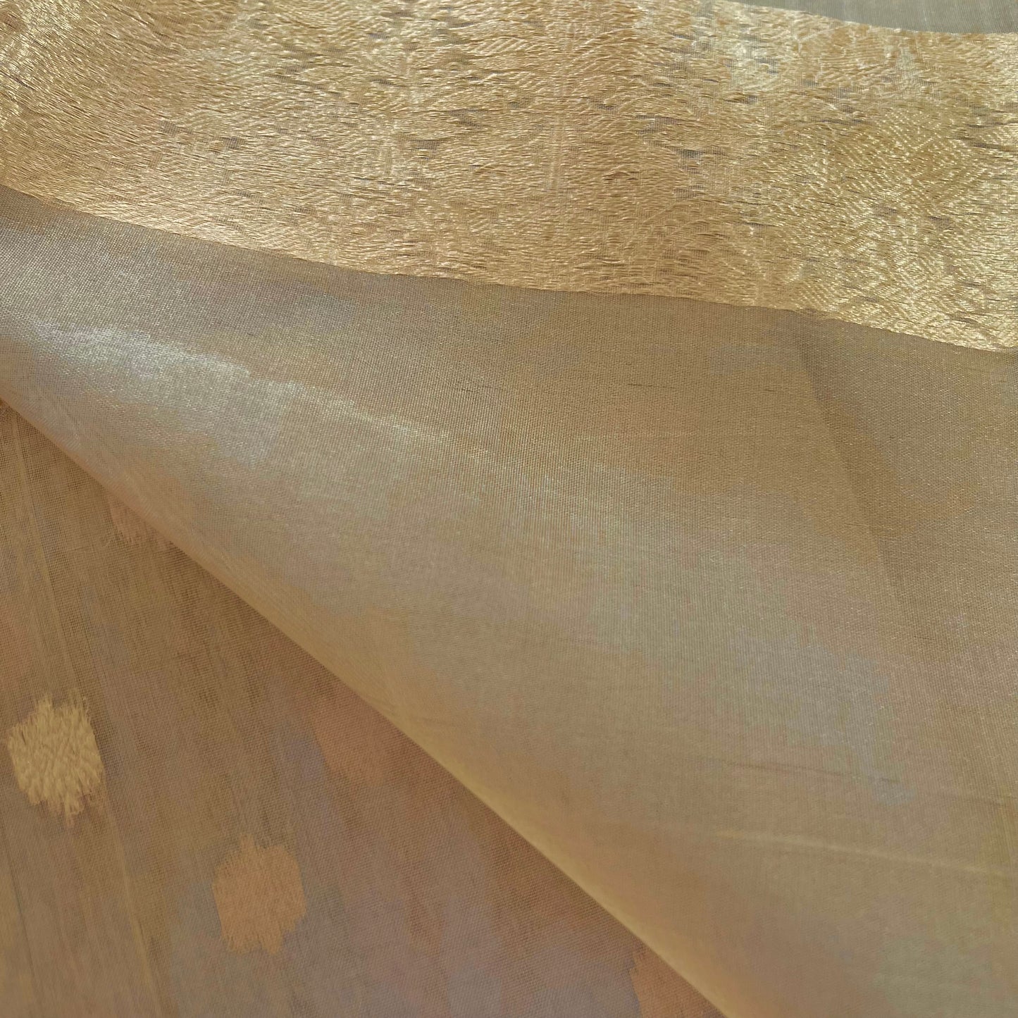 Gold Banarasi tissue silk saree with flower bootis all over