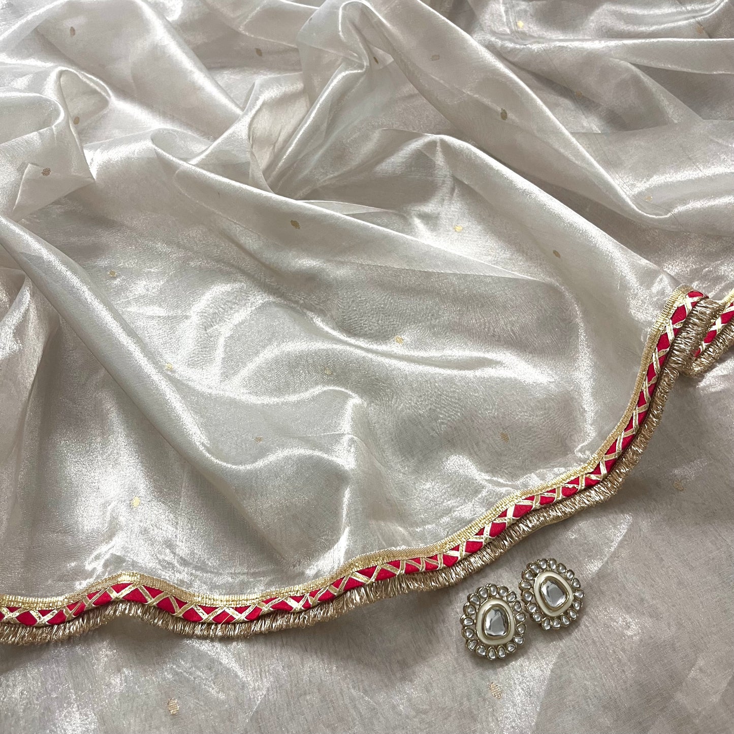 Off white and red Chanderi tissue silk saree with zari bootis all over