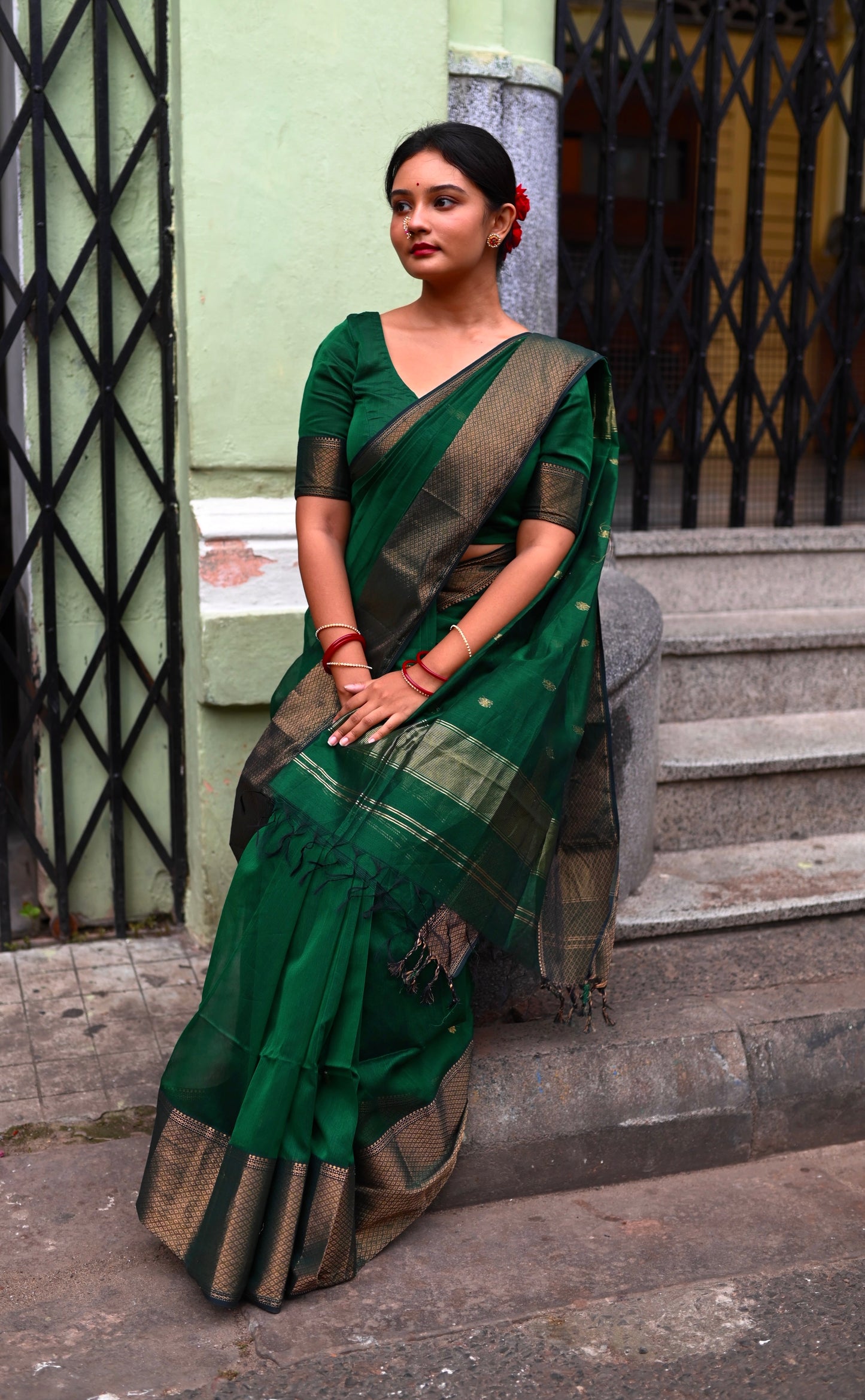 Dark green maheshwari with saree with flower bootis all over