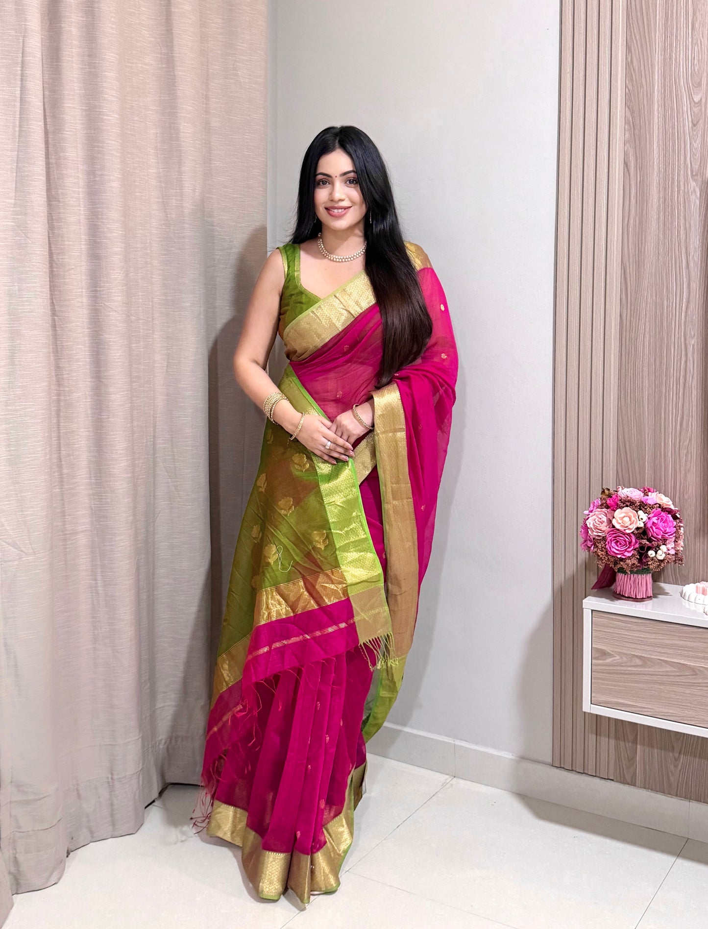 Pink and olive green Maheshwari saree with flower motifs on pallu