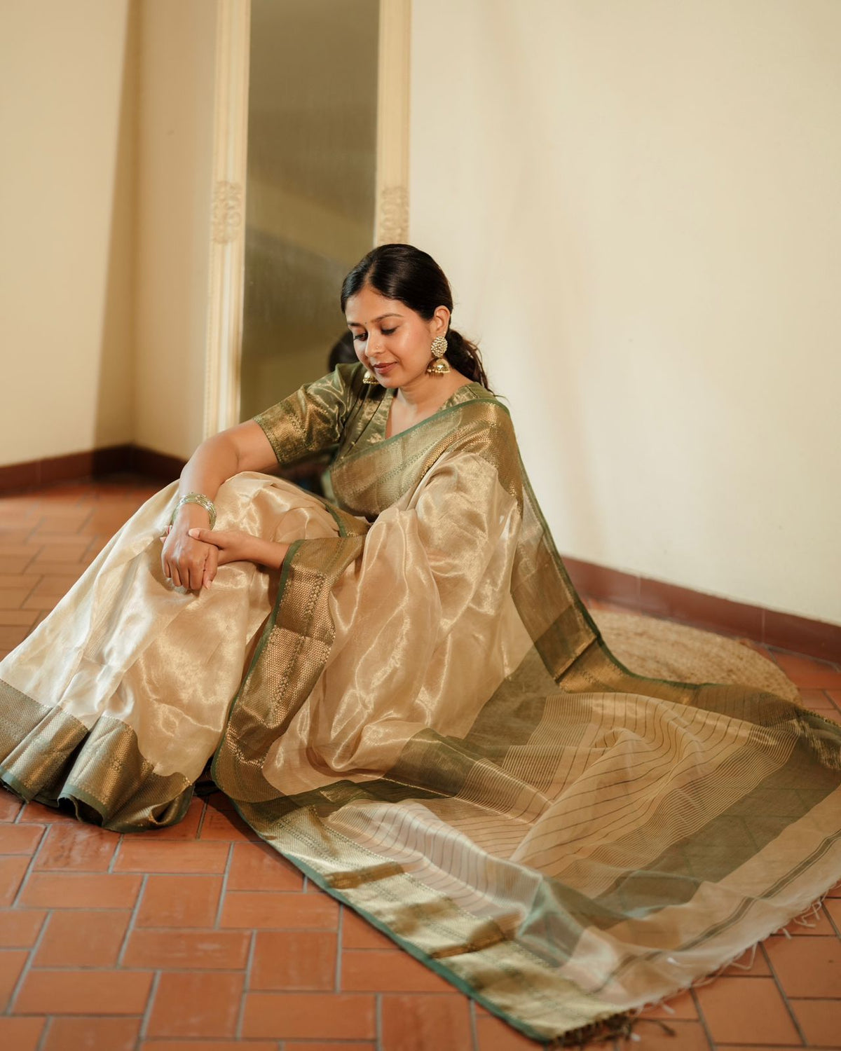 Cream Gold and green Maheshwari tissue silk saree with zari pattern on pallu