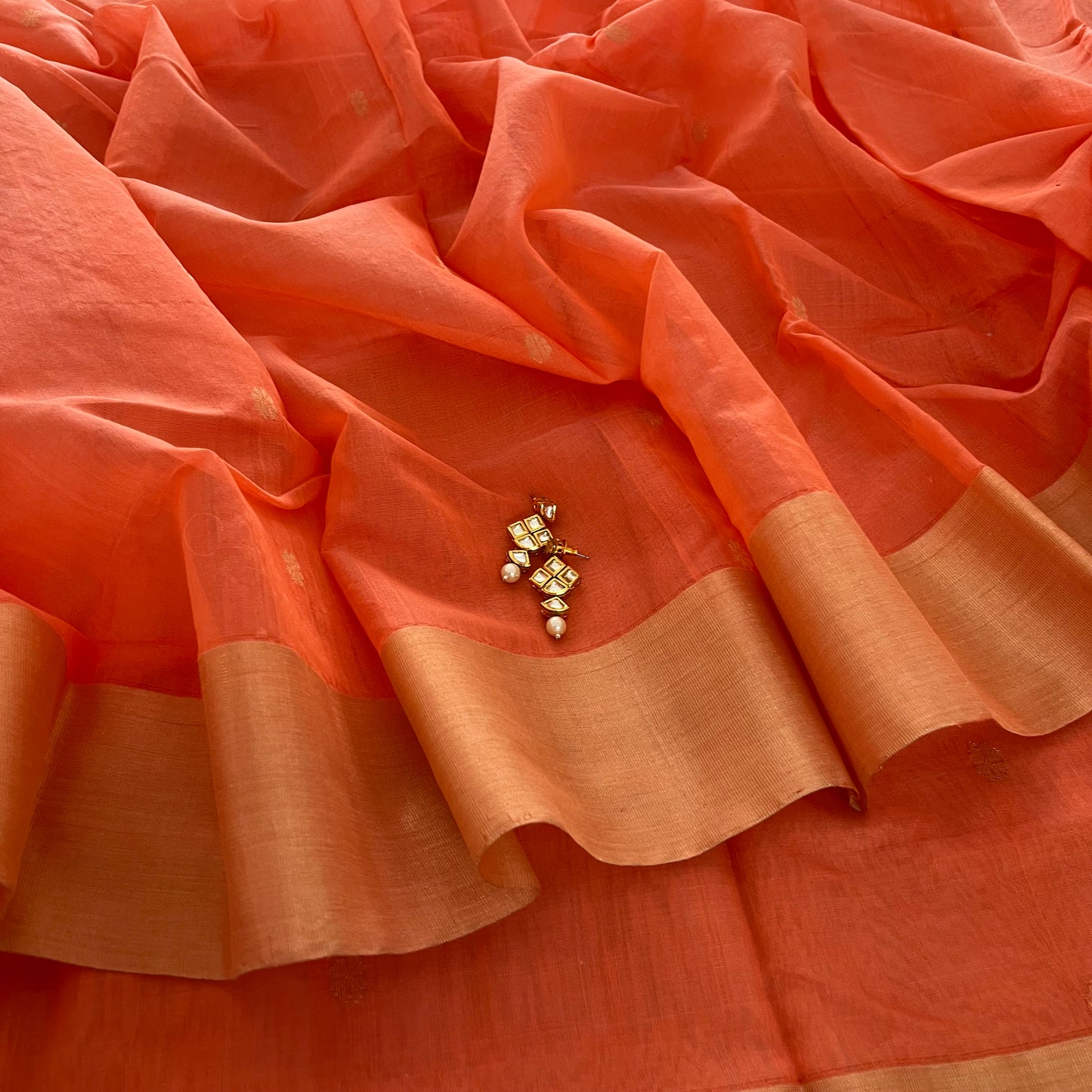 Peachish pink Chanderi saree with zari pattern on pallu