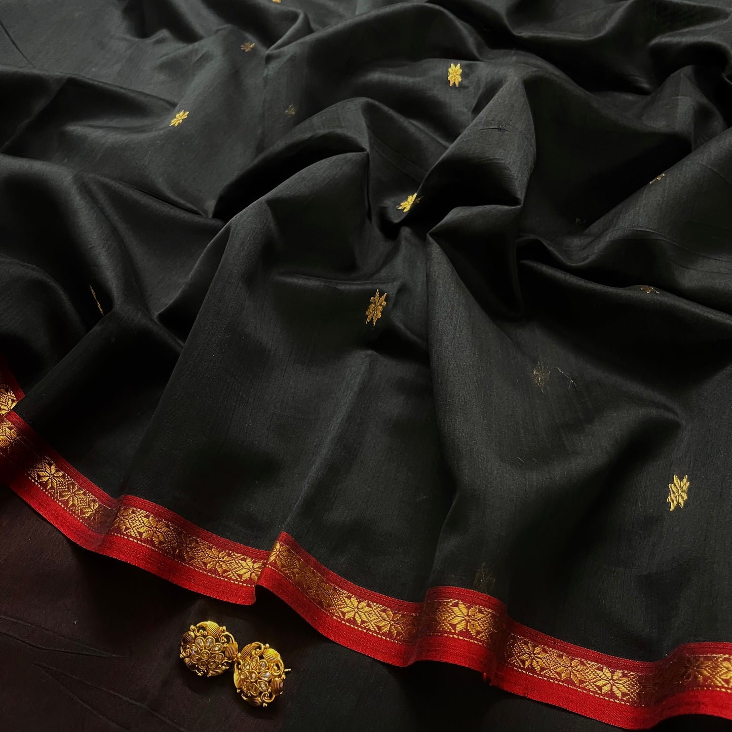 Black and maroon Maheshwari saree with flower bootis all over