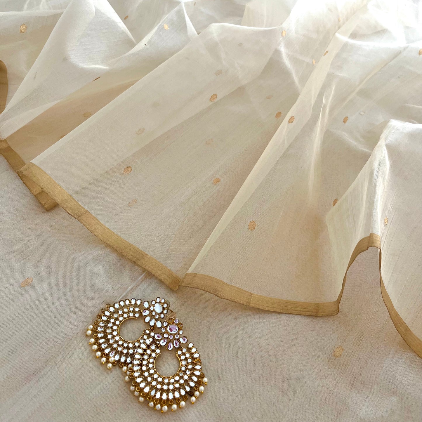 Cream Chanderi organza silk saree with zari bootis all over