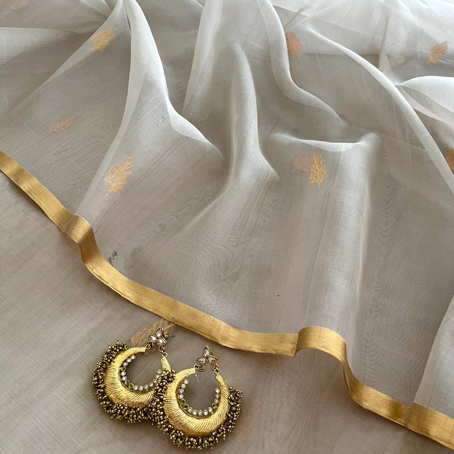 Light grey Chanderi organza silk saree with zari motifs all over