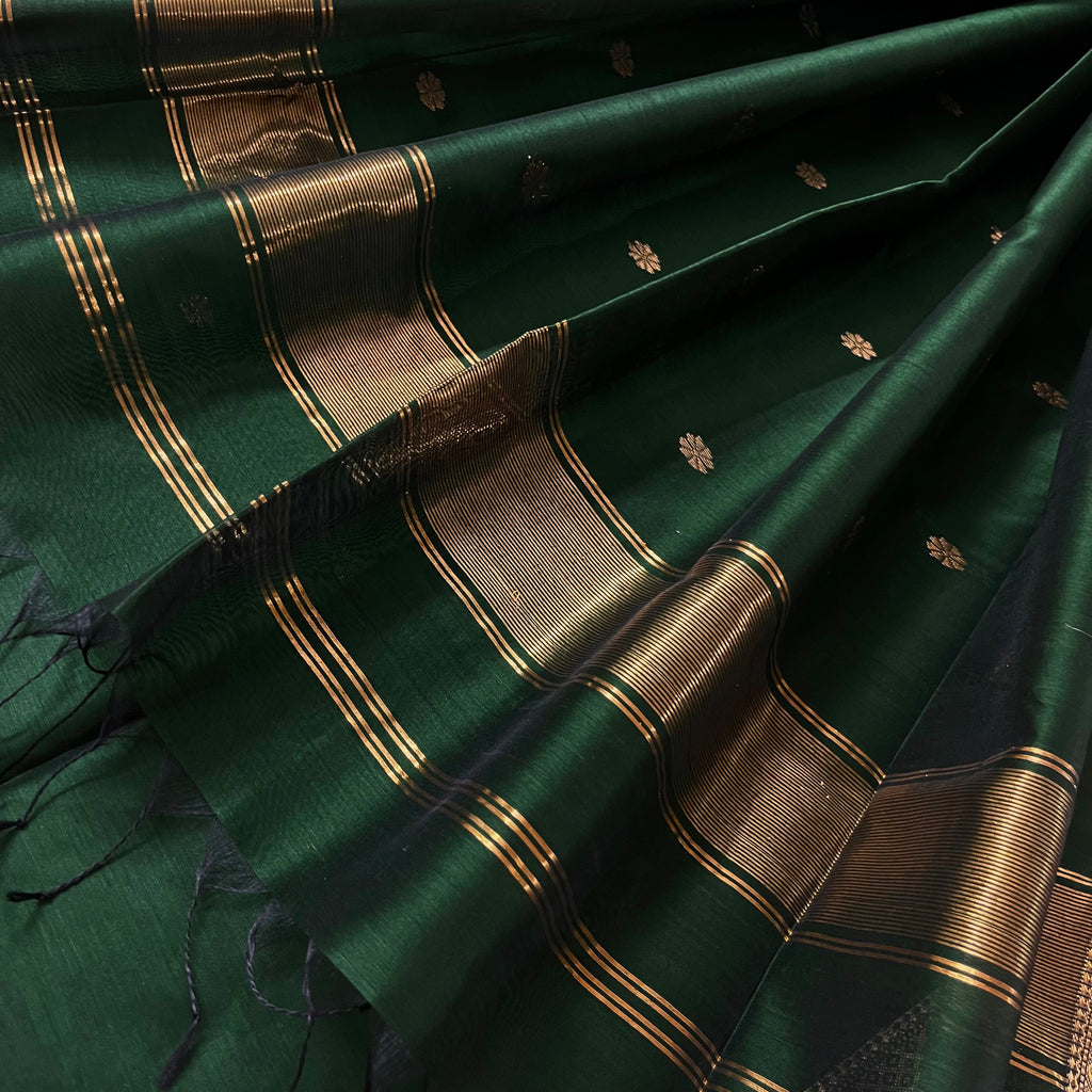 Dark green maheshwari with saree with flower bootis all over