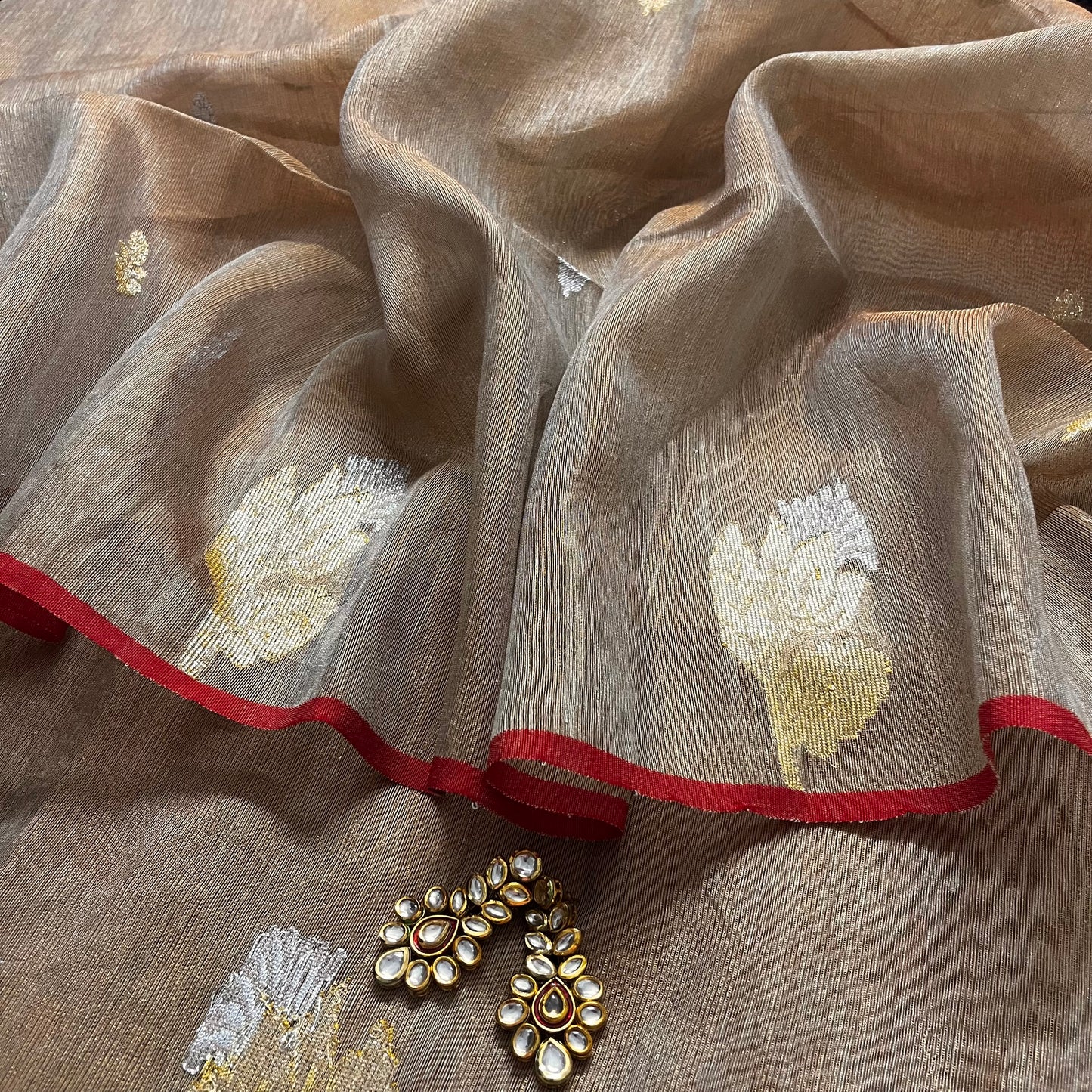 Beige and red linen saree with zari motifs all over