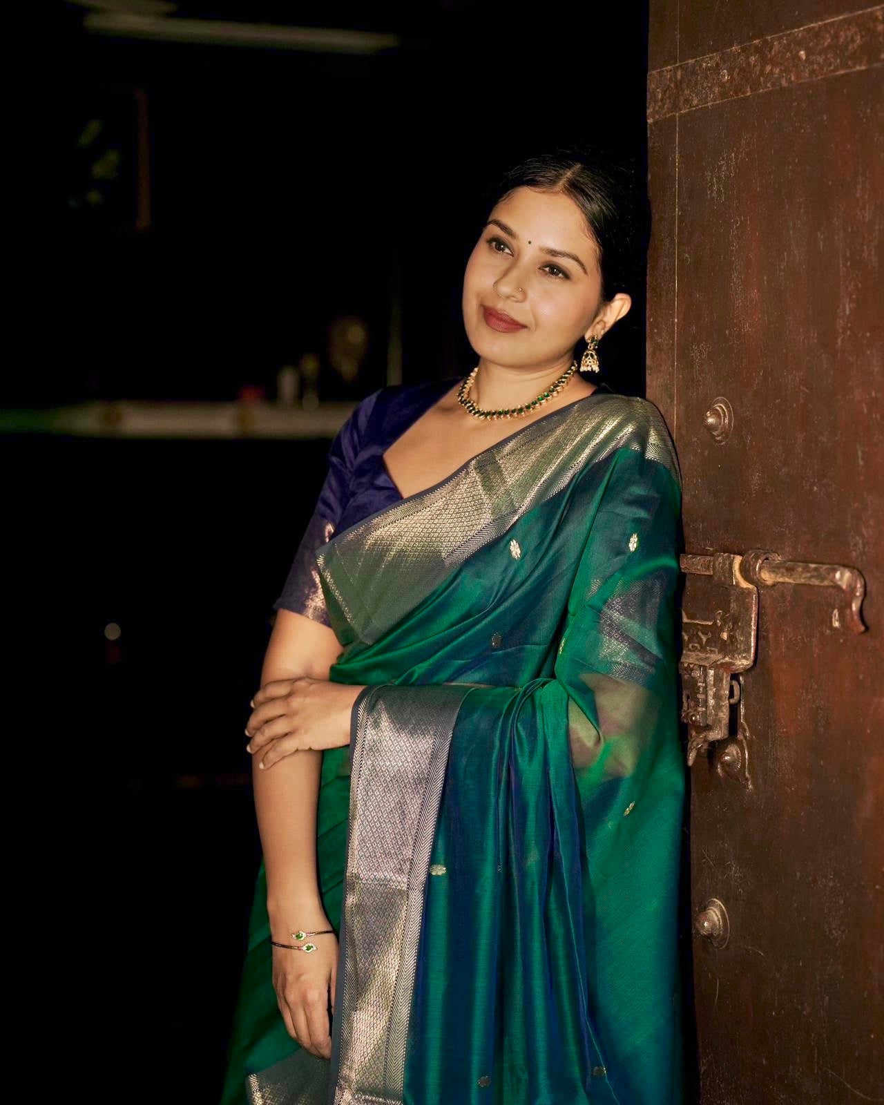 Dark Green and blue maheshwari dual tone saree with flower bootis all over