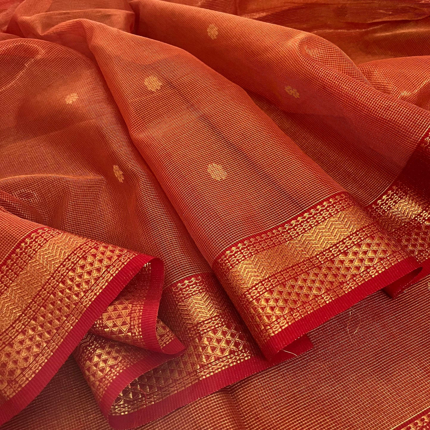 Red and gold Maheshwari silk saree with zari jaal work on pallu