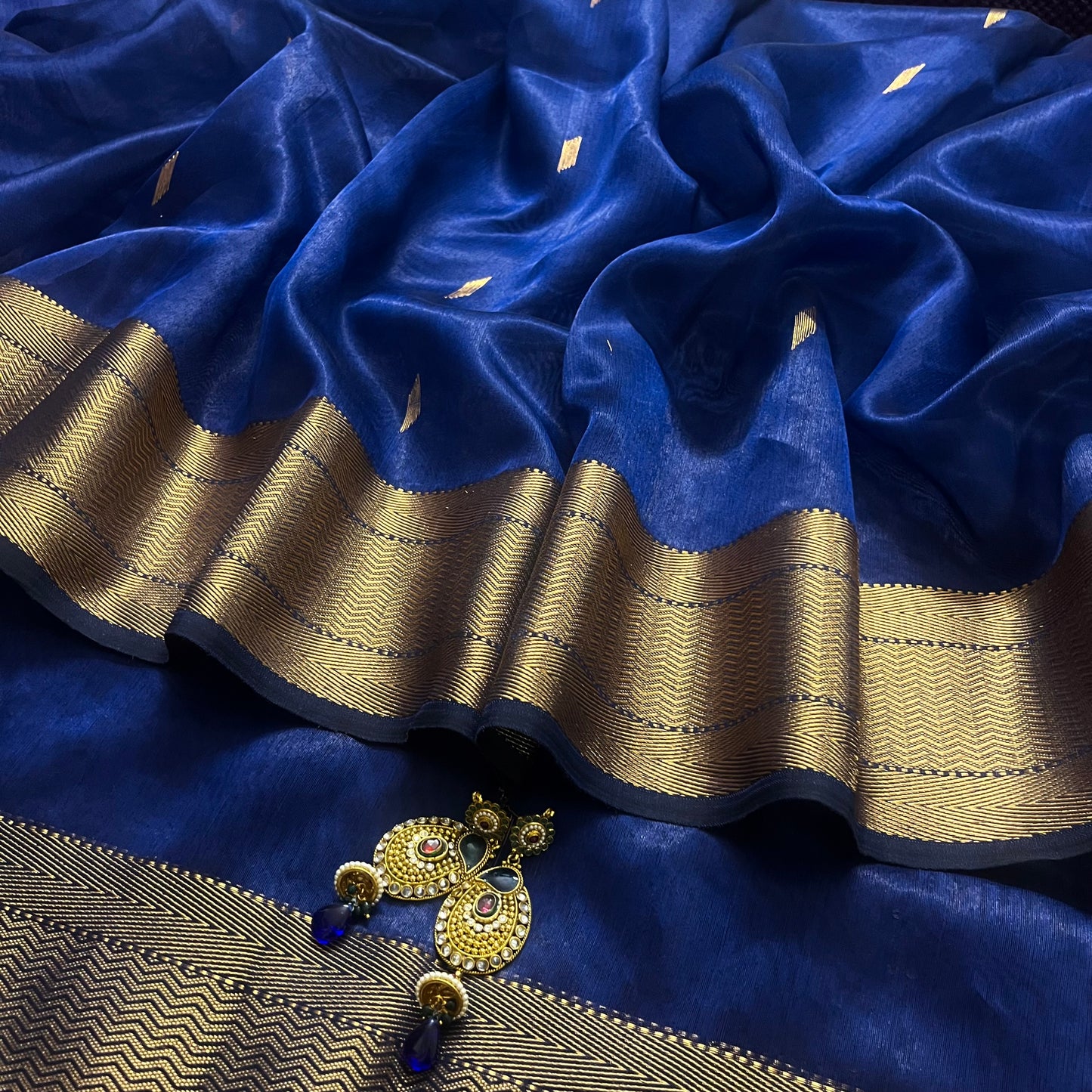 Dark blue Maheshwari tissue silk saree with zari bootis all over