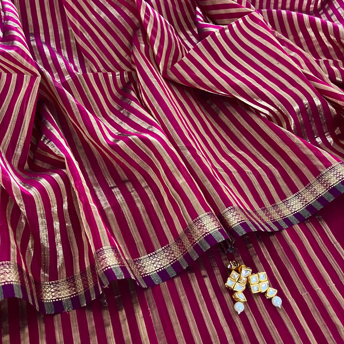 Dark pink Maheshwari saree with zari stripes all over