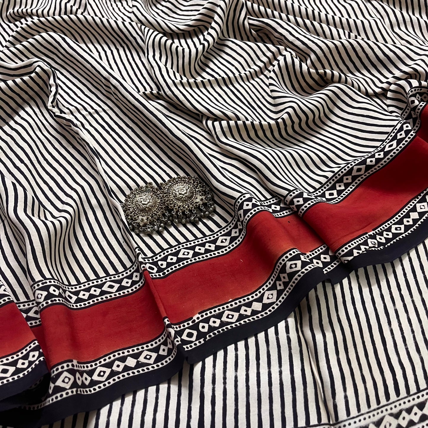 White and black silk saree with block print all over