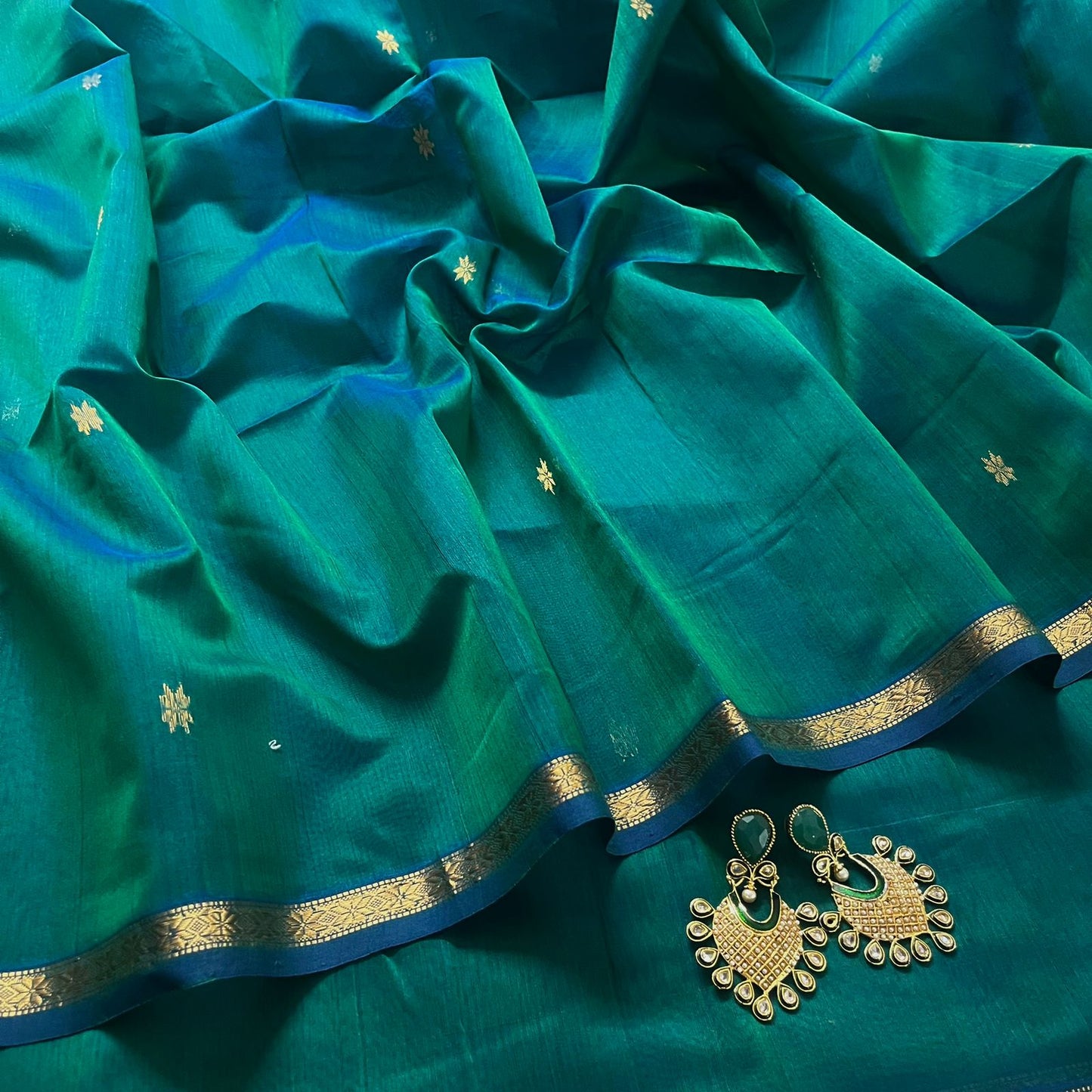 Peacock green and blue Maheshwari saree with zari border and zari bootis all over