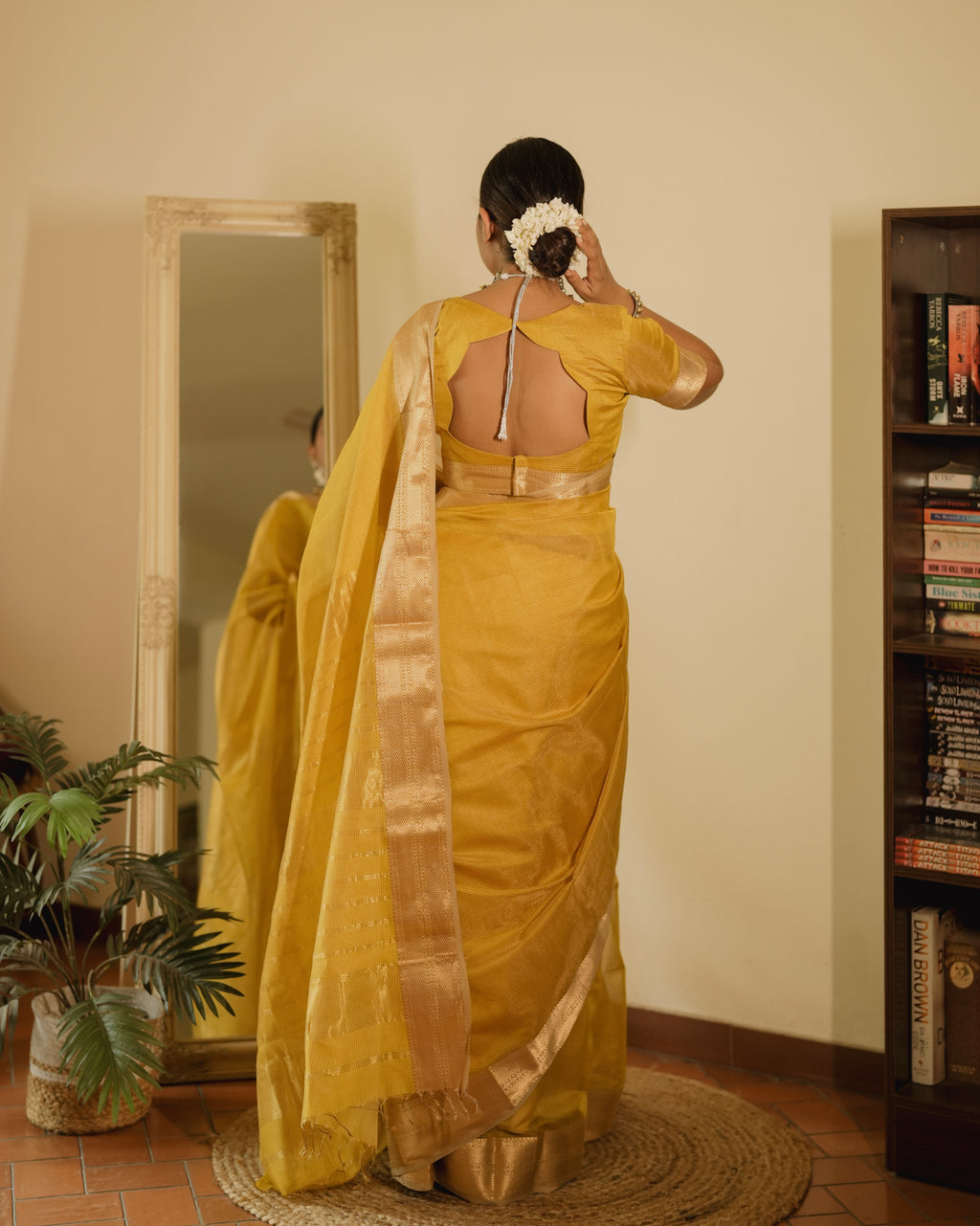 Yellow Maheshwari saree with zari lines all over