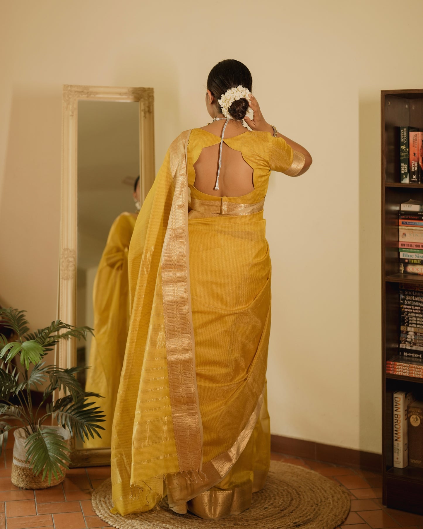 Yellow Maheshwari saree with zari lines all over
