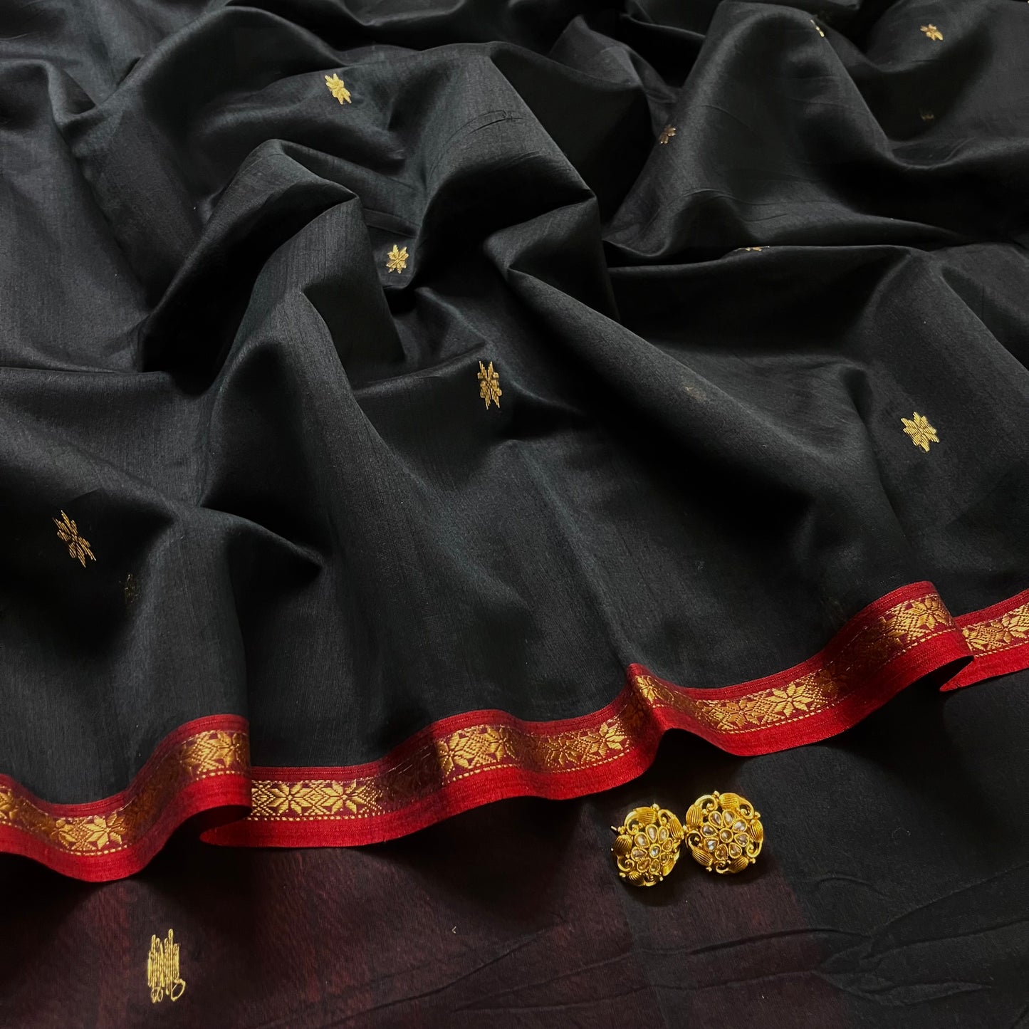 Black and maroon Maheshwari saree with flower bootis all over