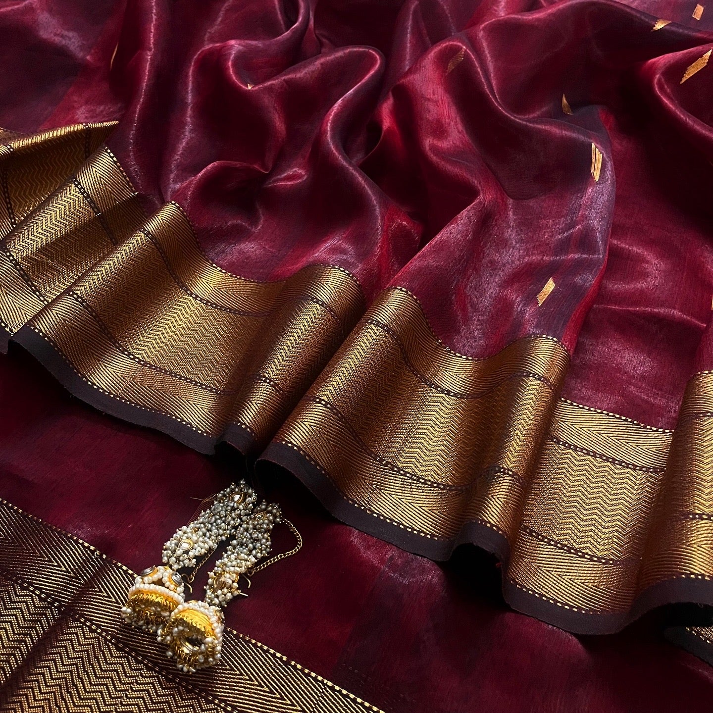 Mahogany Maheshwari tissue silk saree with zari bootis all over