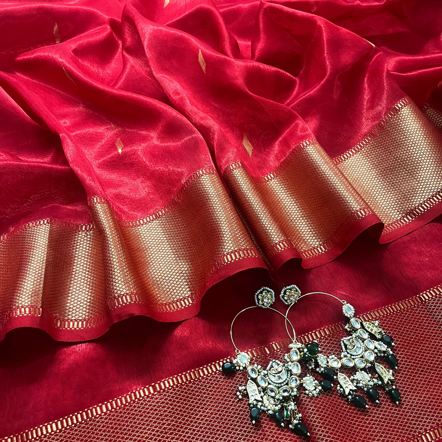 Red Maheshwari tissue silk saree with zari bootis all over