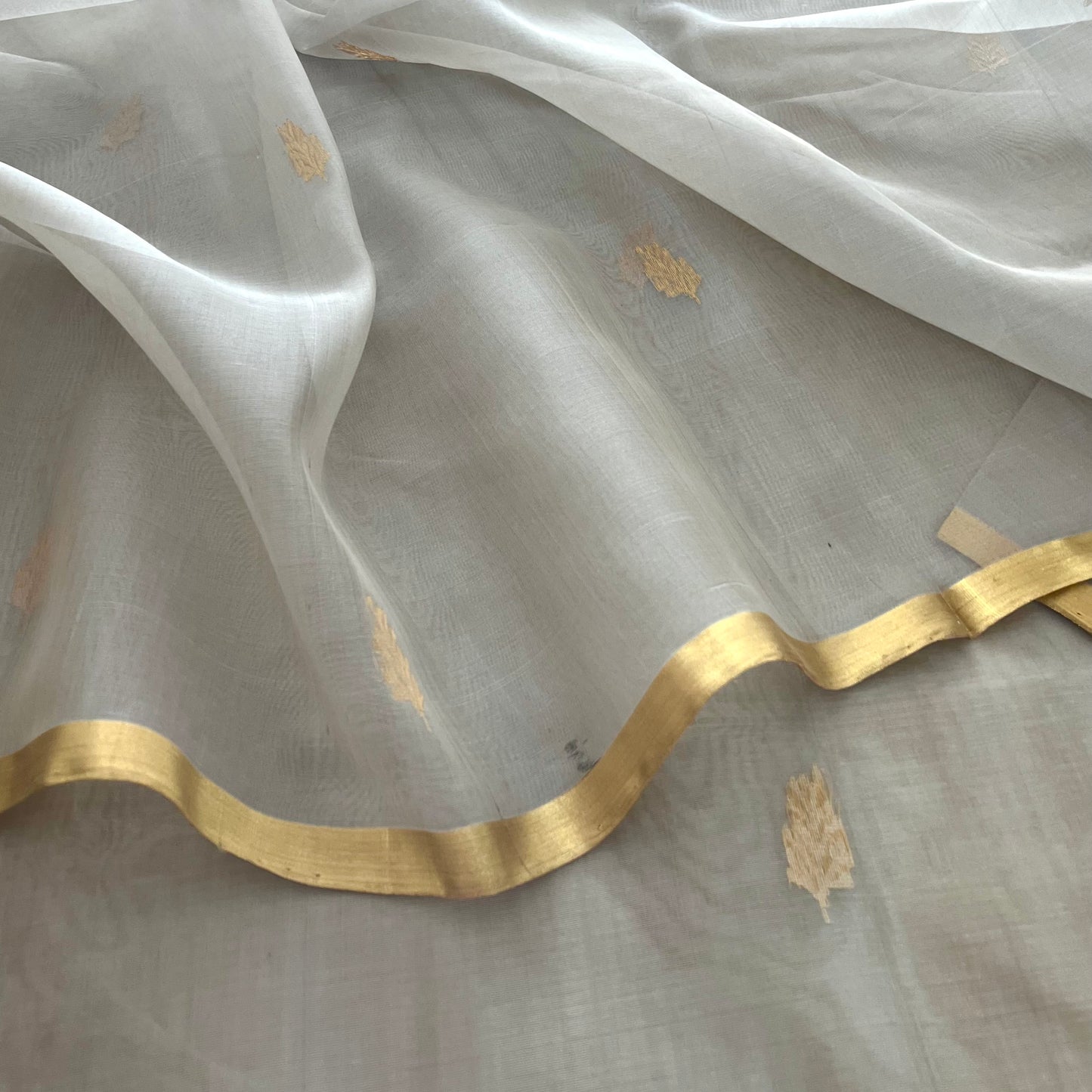 Light grey Chanderi organza silk saree with zari motifs all over
