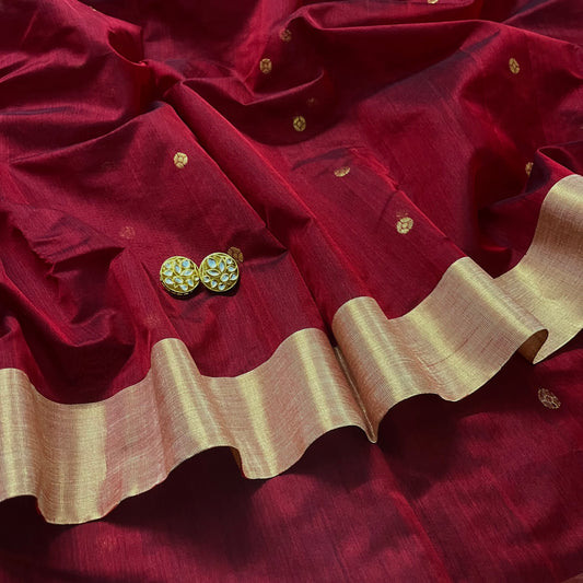 Deep maroon Chanderi saree with zari bootis all over and flower motifs on pallu