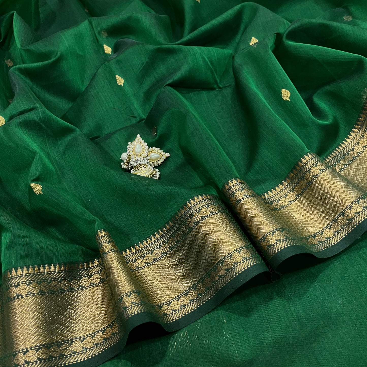 Bottle green Maheshwari saree with zari bootis and zari border