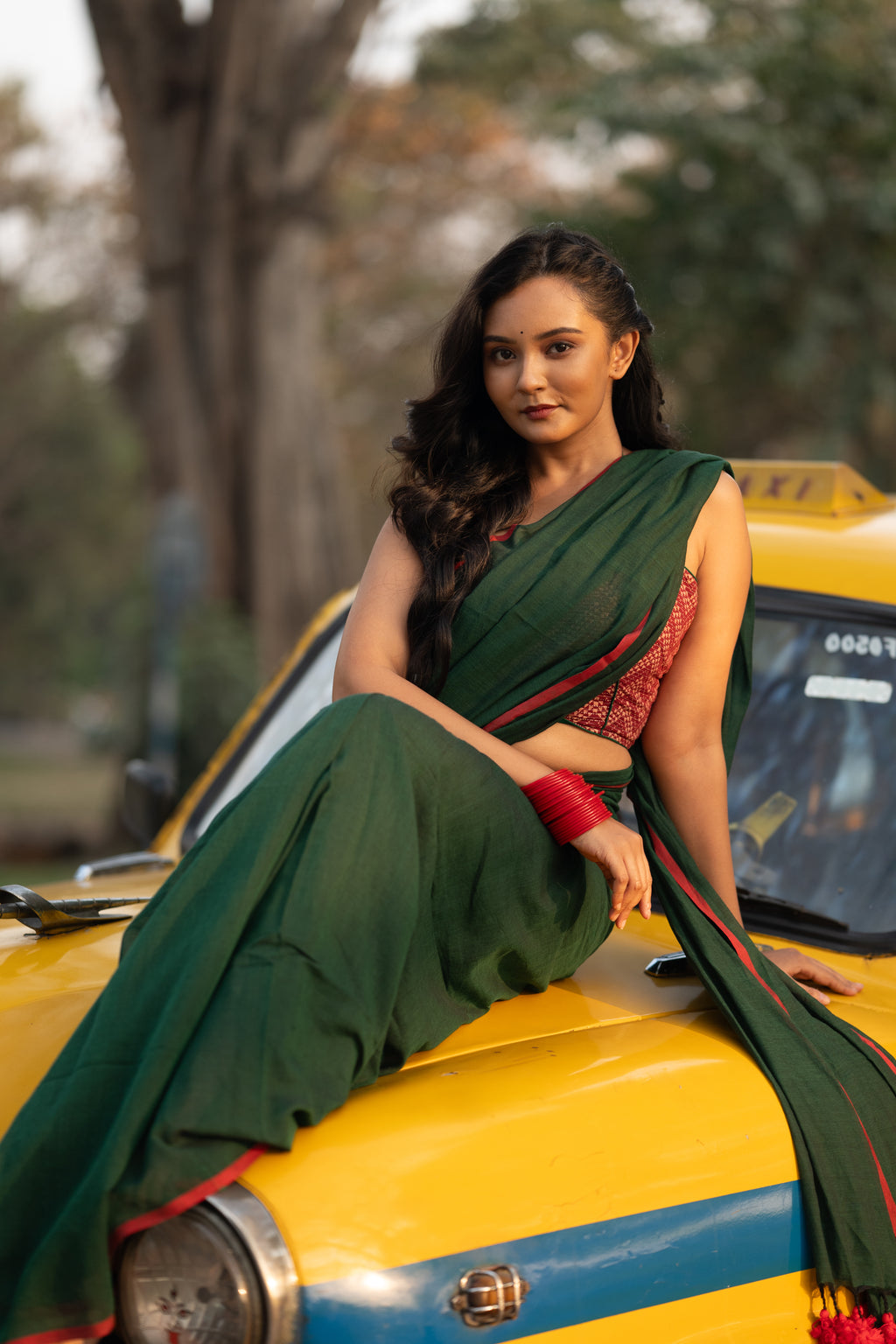 Dark green and red mulmul saree