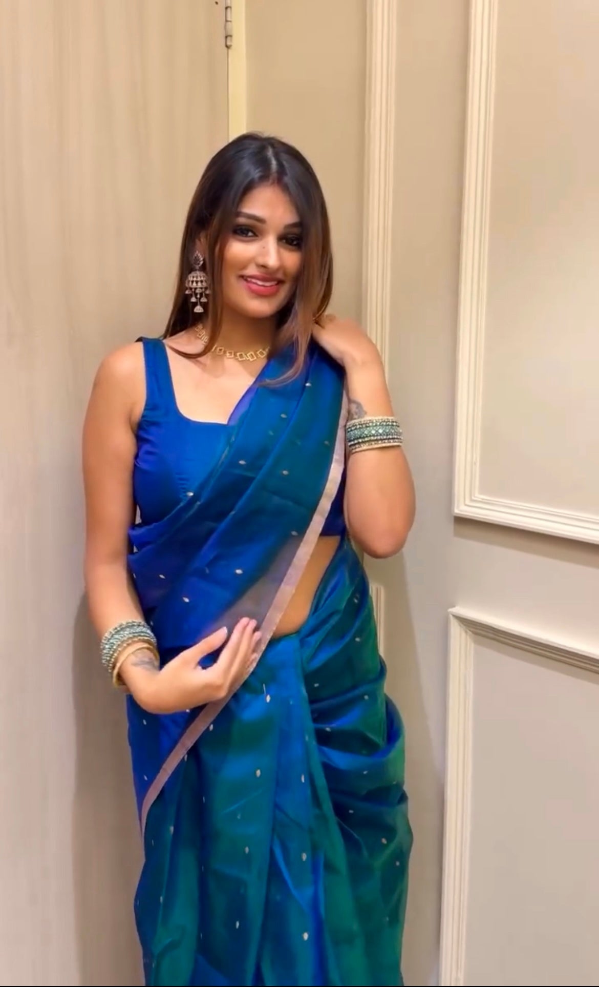 Peacock blue and green dual tone Chanderi organza silk saree with zari bootis all over