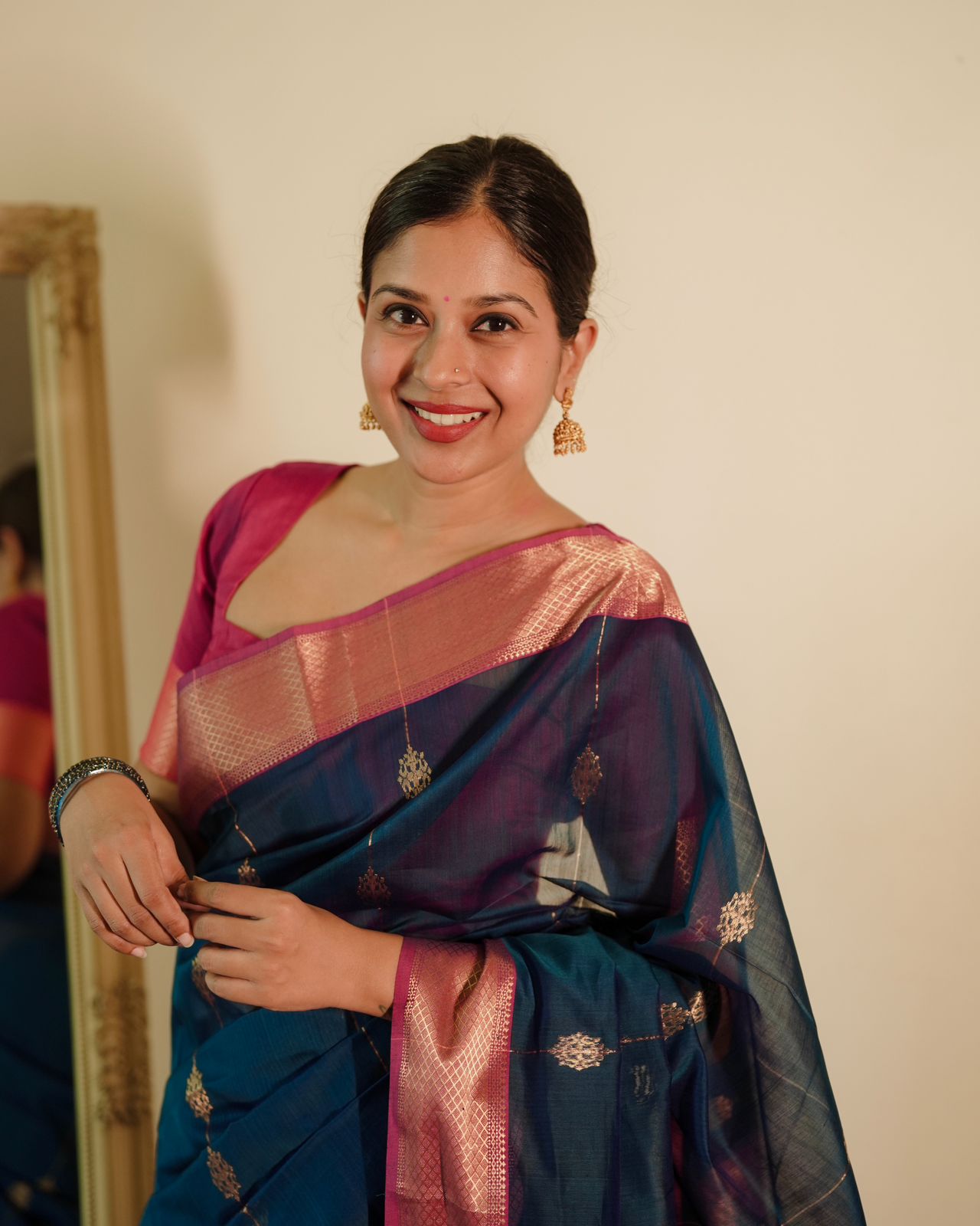 Peacock blue and pink Maheshwari saree with zari motifs all over