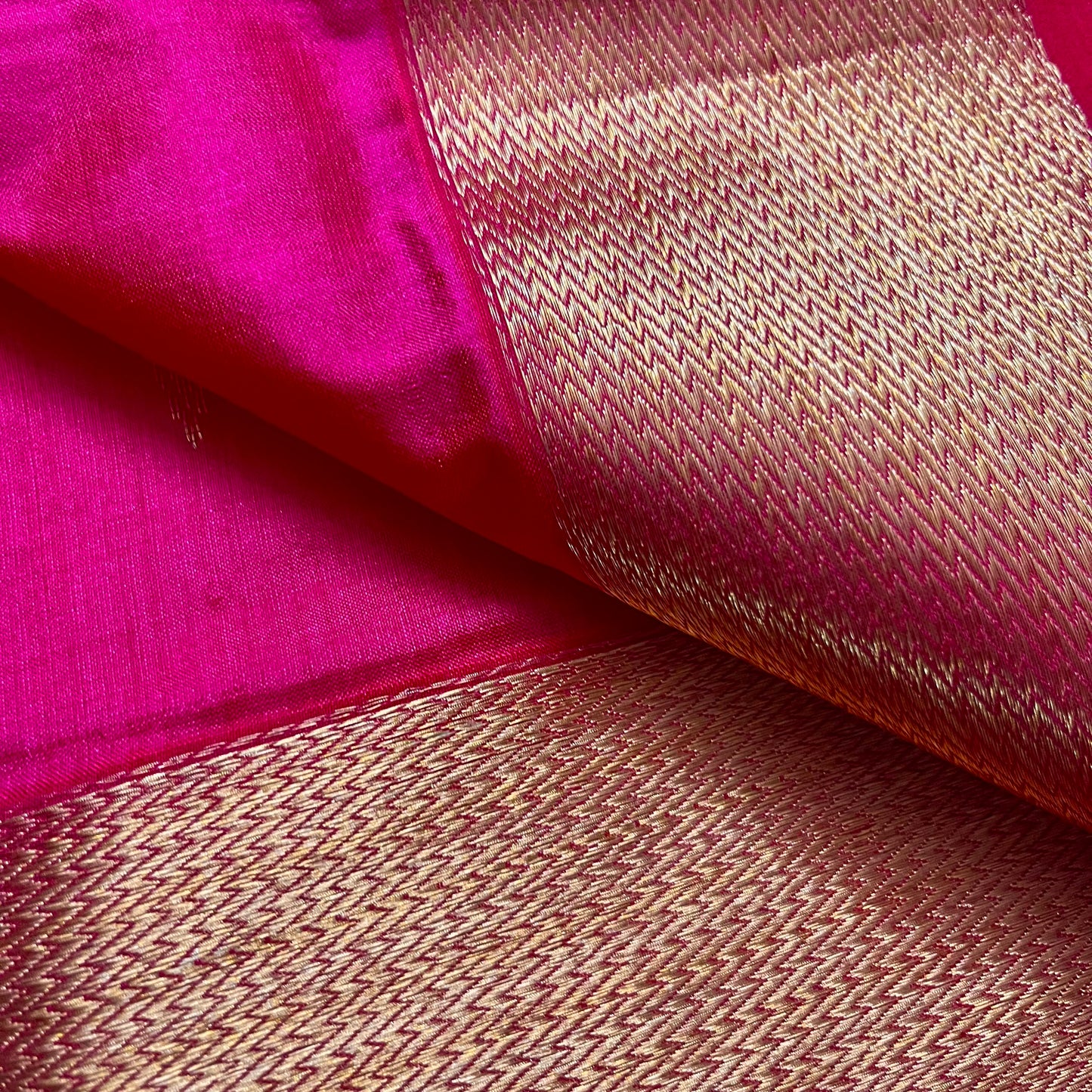 Rani pink Maheshwari silk saree with zari motifs on pallu
