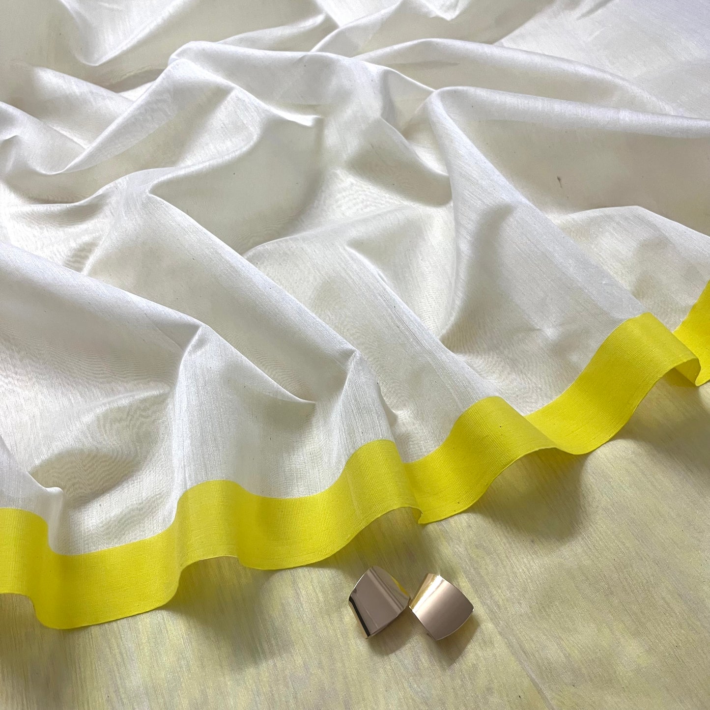 White and lemon Chanderi saree with zari lines on pallu