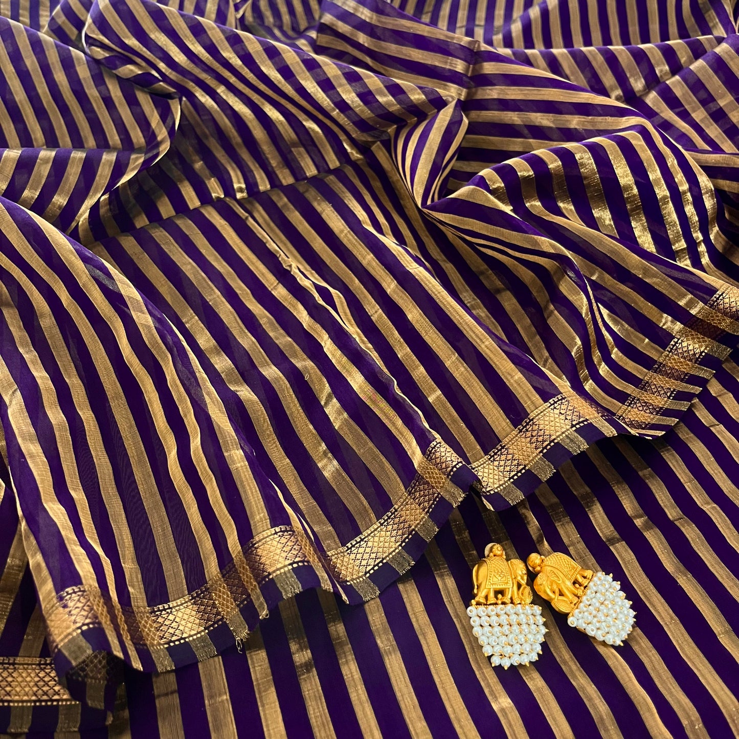 Dark purple and gold Maheshwari saree with zari stripes all over