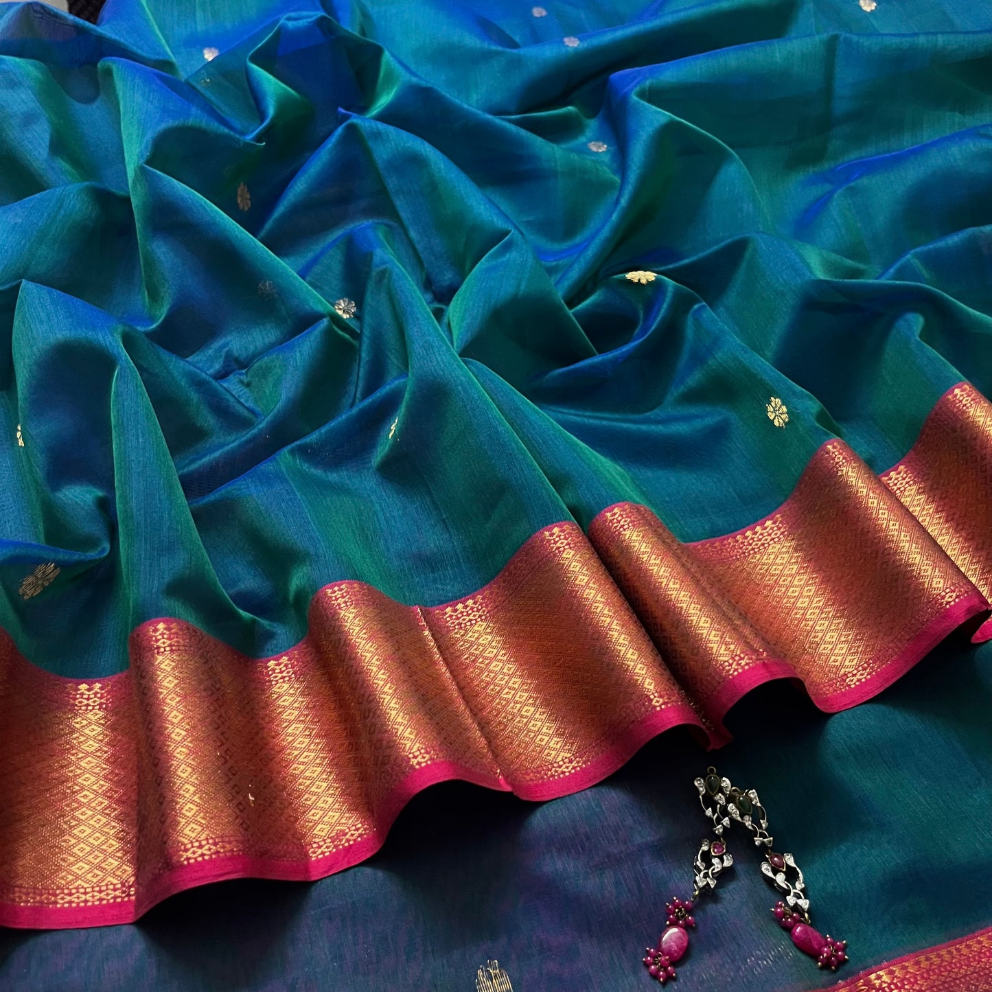Peacock and Violet dual tone Maheshwari saree with flower motifs on pallu