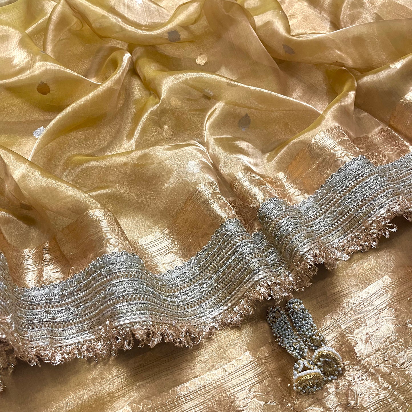 Gold Banarasi tissue silk saree with zari bootis and border