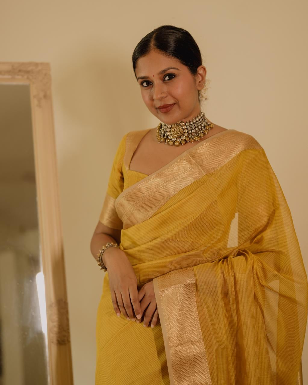 Yellow Maheshwari saree with zari lines all over
